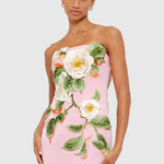 Woman wearing pink strapless maxi dress with white floral appliqué — Leo Lin | Endless UAE