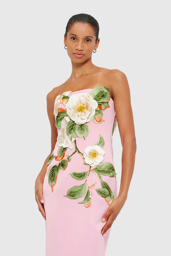 Woman wearing pink strapless maxi dress with white floral appliqué — Leo Lin | Endless UAE