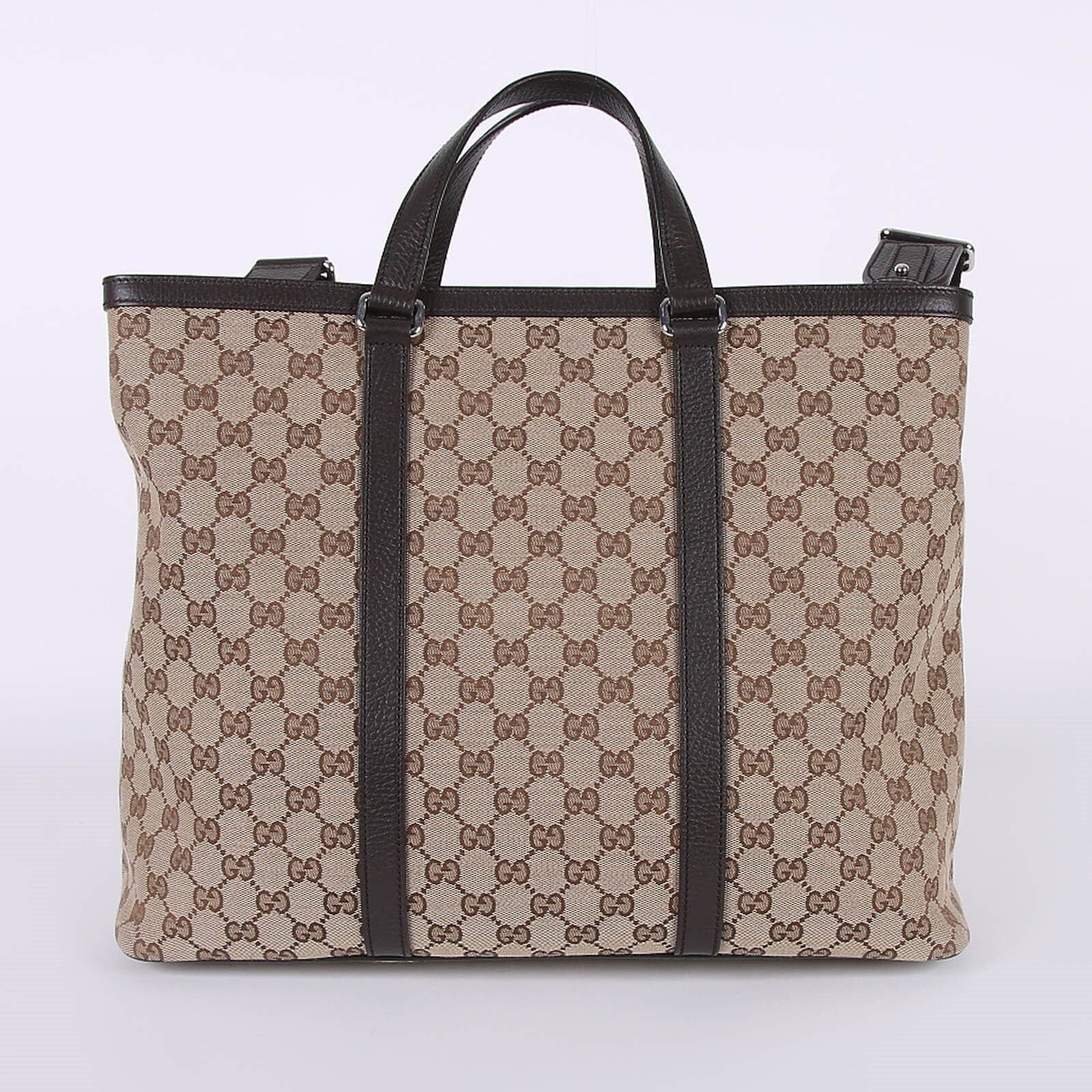Beige GG canvas tote bag with brown leather handles and trim, featuring signature monogram pattern — Gucci | Endless UAE