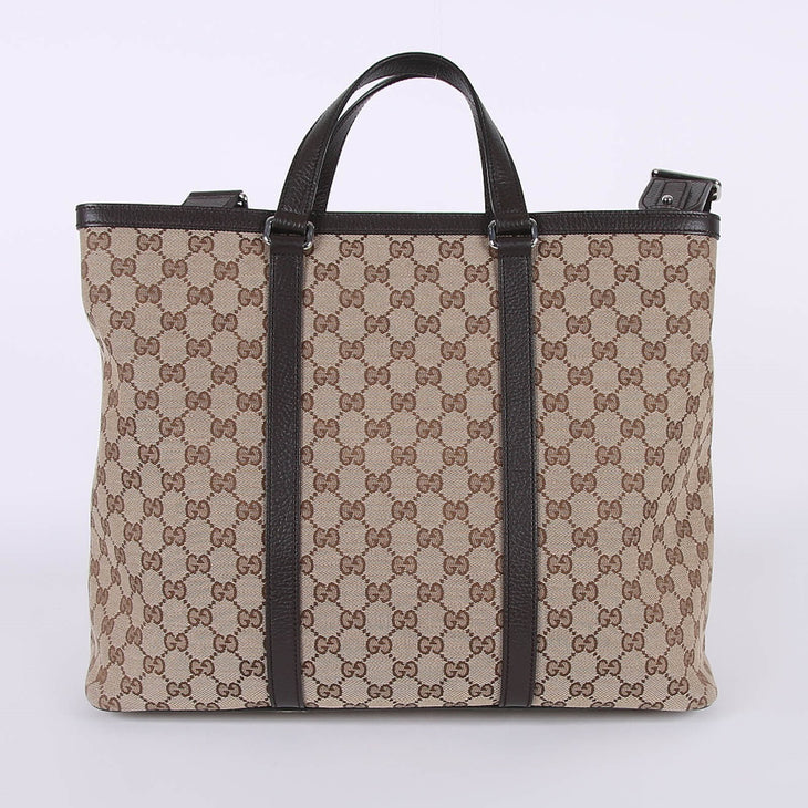 Beige GG canvas tote bag with brown leather handles and trim, featuring signature monogram pattern — Gucci | Endless UAE