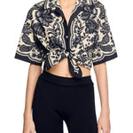 Cropped floral print shirt with black and beige pattern, tie-front detail and kimono sleeves — Sandro | Endless UAE