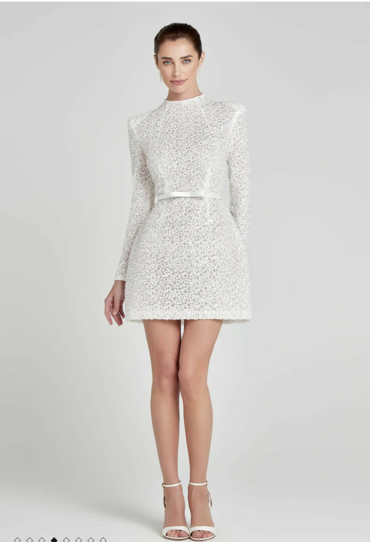 White sequin mini dress with long sleeves and high neck worn with strappy heels — Nadine Merabi | Endless UAE