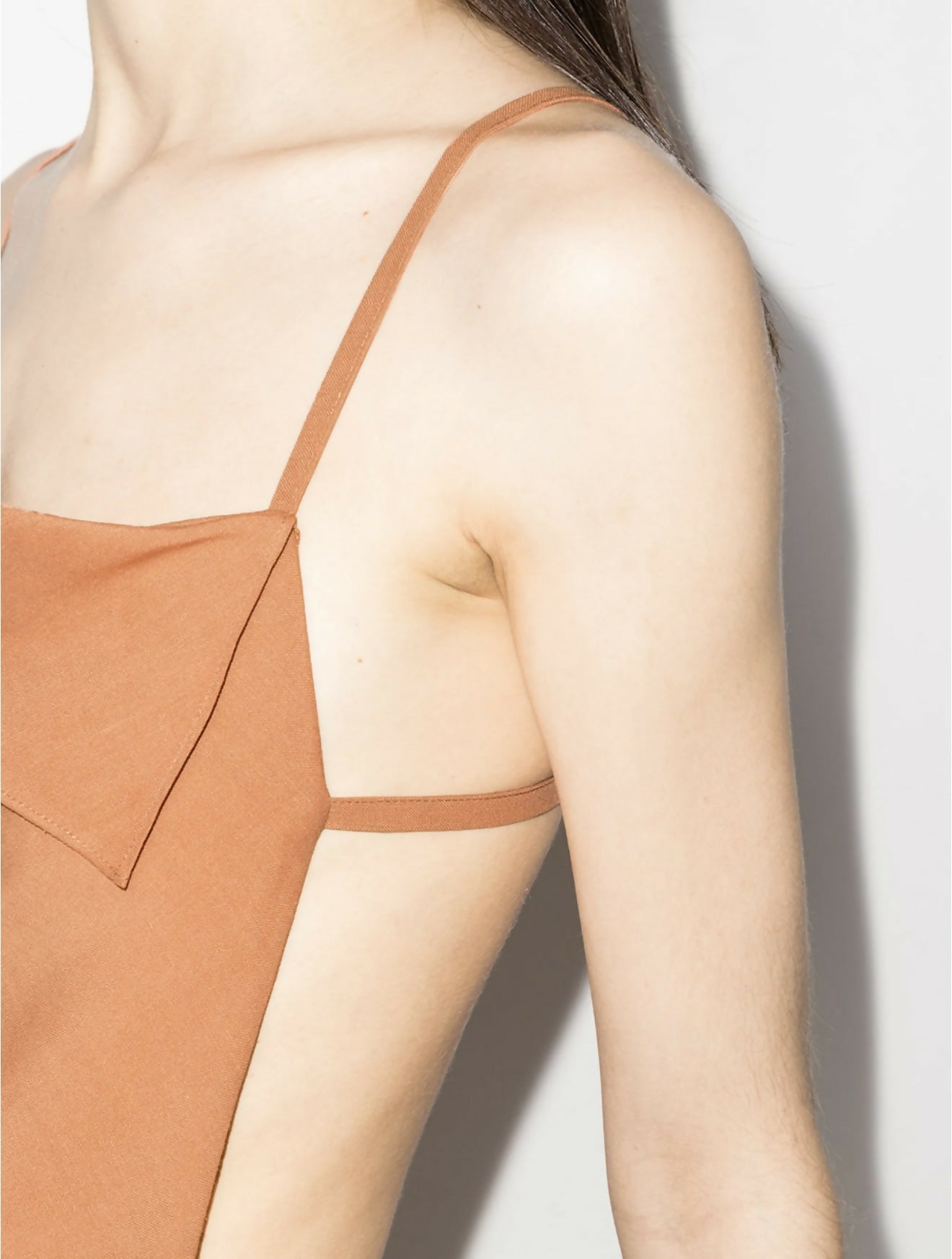 Terracotta asymmetrical dress with thin straps and ruched side detail on model — Jacquemus | Endless UAE