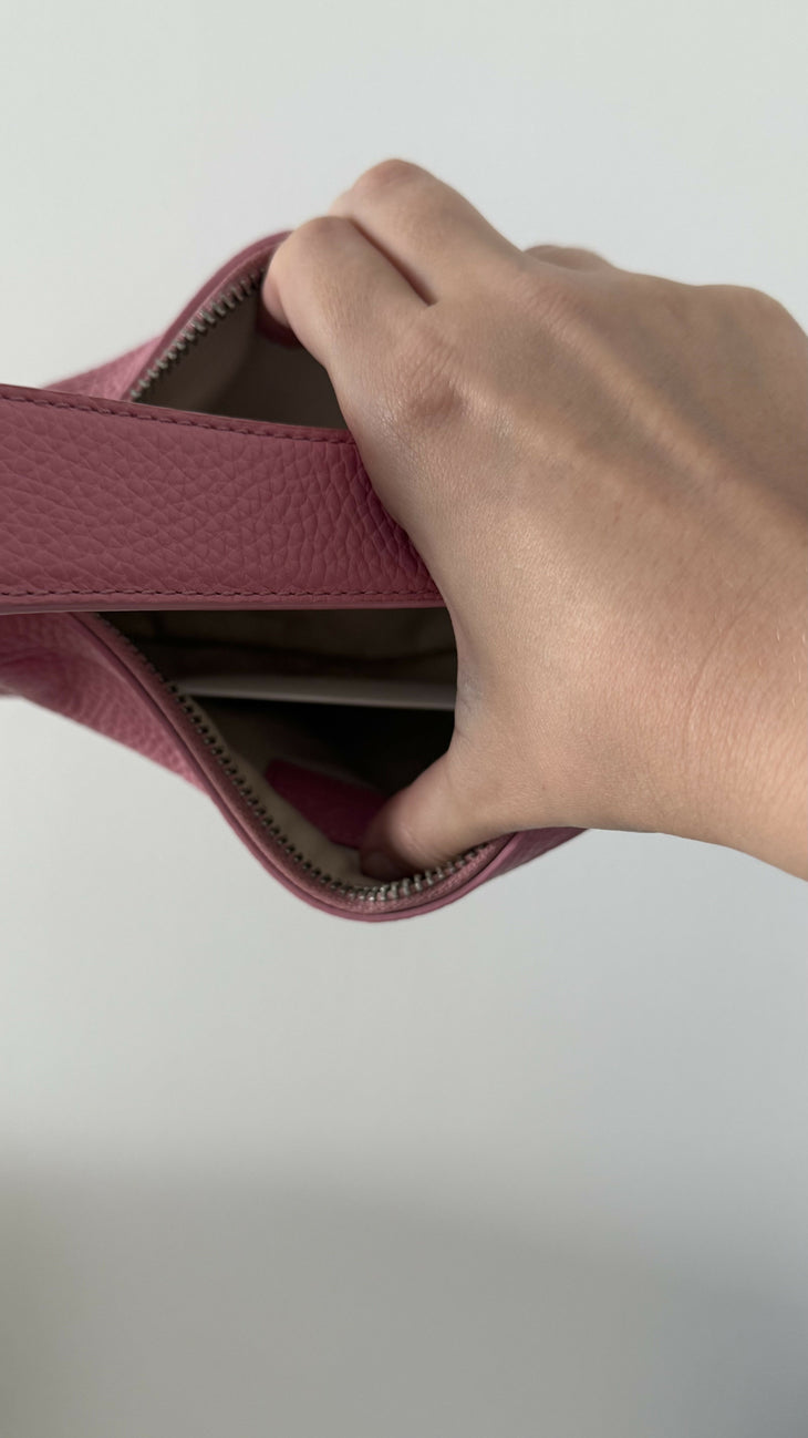 Pink leather mini shoulder bag with dual handles displayed against neutral background — By Far | Endless UAE