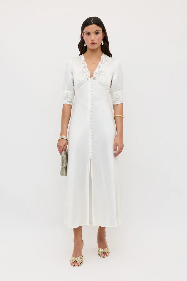 Elegant white midi dress with lace trim collar and cuffs, button-front closure, and center slit by Rixo — Rixo | Endless UAE