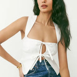 White linen crop top with tie-front cutout detail and wide straps — Reformation | Endless UAE