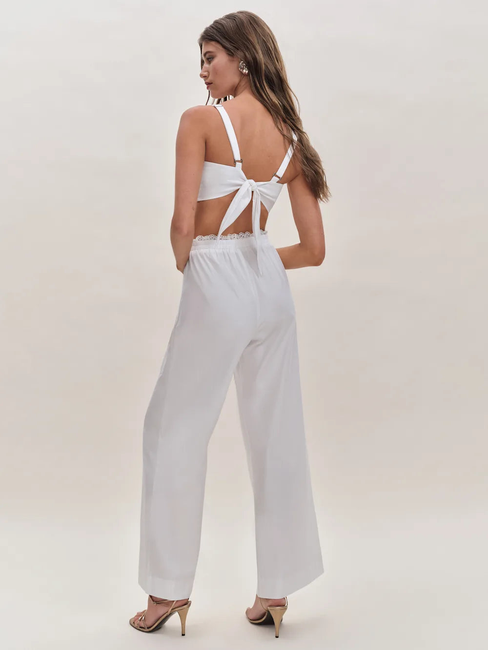 White two-piece set with tie-back crop top and wide-leg pants featuring lace trim detail — Reformation | Endless UAE