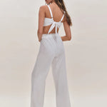 White two-piece set with tie-back crop top and wide-leg pants featuring lace trim detail — Reformation | Endless UAE