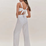 White two-piece set with tie-back crop top and wide-leg pants featuring lace trim detail — Reformation | Endless UAE