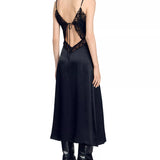 Black satin slip dress with ornate lace cutout back detail and adjustable straps, worn with leather boots — Sandro | Endless UAE