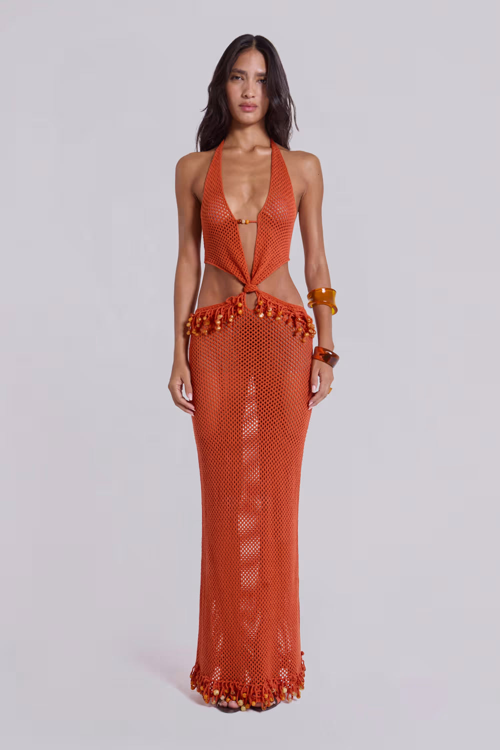 Woman wearing orange beaded crochet halter maxi dress with open back — Jaded London | Endless UAE