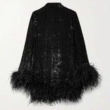 Black feather-trimmed devore dress with high neckline on model — Taller Marmo | Endless UAE