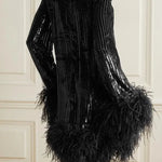 Black feather-trimmed devore dress with high neckline on model — Taller Marmo | Endless UAE