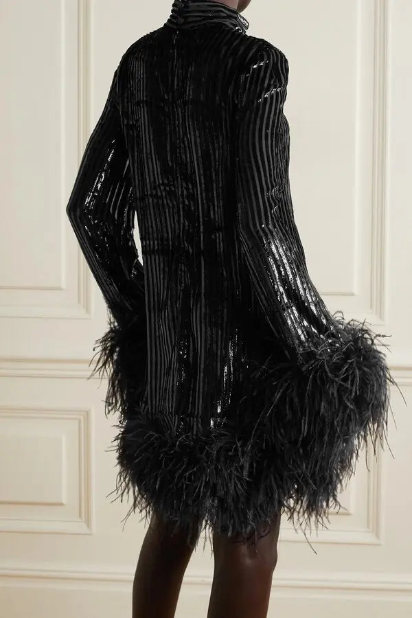 Black feather-trimmed devore dress with high neckline on model — Taller Marmo | Endless UAE