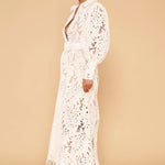 Ophelia Lace Maxi Dress in white with intricate cutout details and long sleeves — Derma Department | Endless UAE