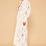 Ophelia Lace Maxi Dress in white with intricate cutout details and long sleeves — Derma Department | Endless UAE