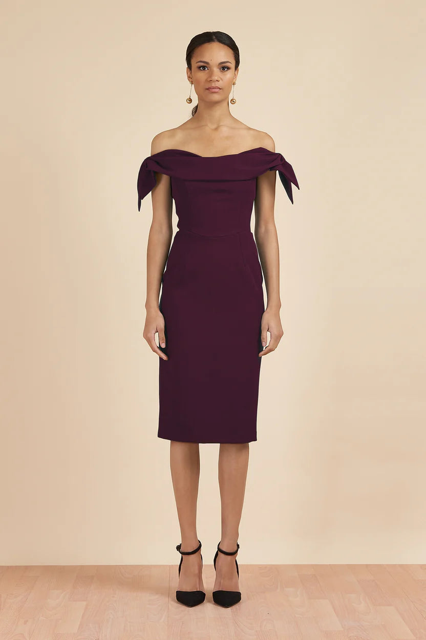 Woman wearing burgundy off-shoulder pencil dress with tie sleeves — The Pretty Dress Company | Endless UAE