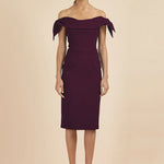 Woman wearing burgundy off-shoulder pencil dress with tie sleeves — The Pretty Dress Company | Endless UAE