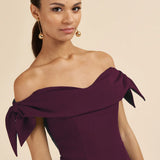 Woman wearing burgundy off-shoulder pencil dress with tie sleeves — The Pretty Dress Company | Endless UAE