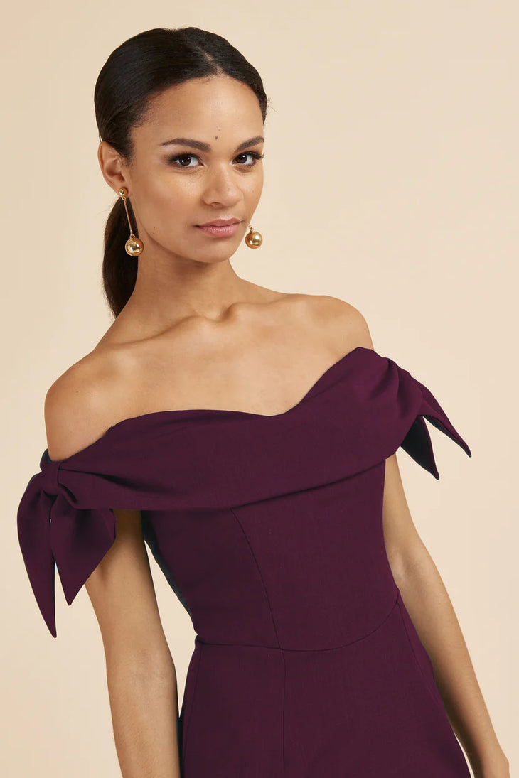 Woman wearing burgundy off-shoulder pencil dress with tie sleeves — The Pretty Dress Company | Endless UAE