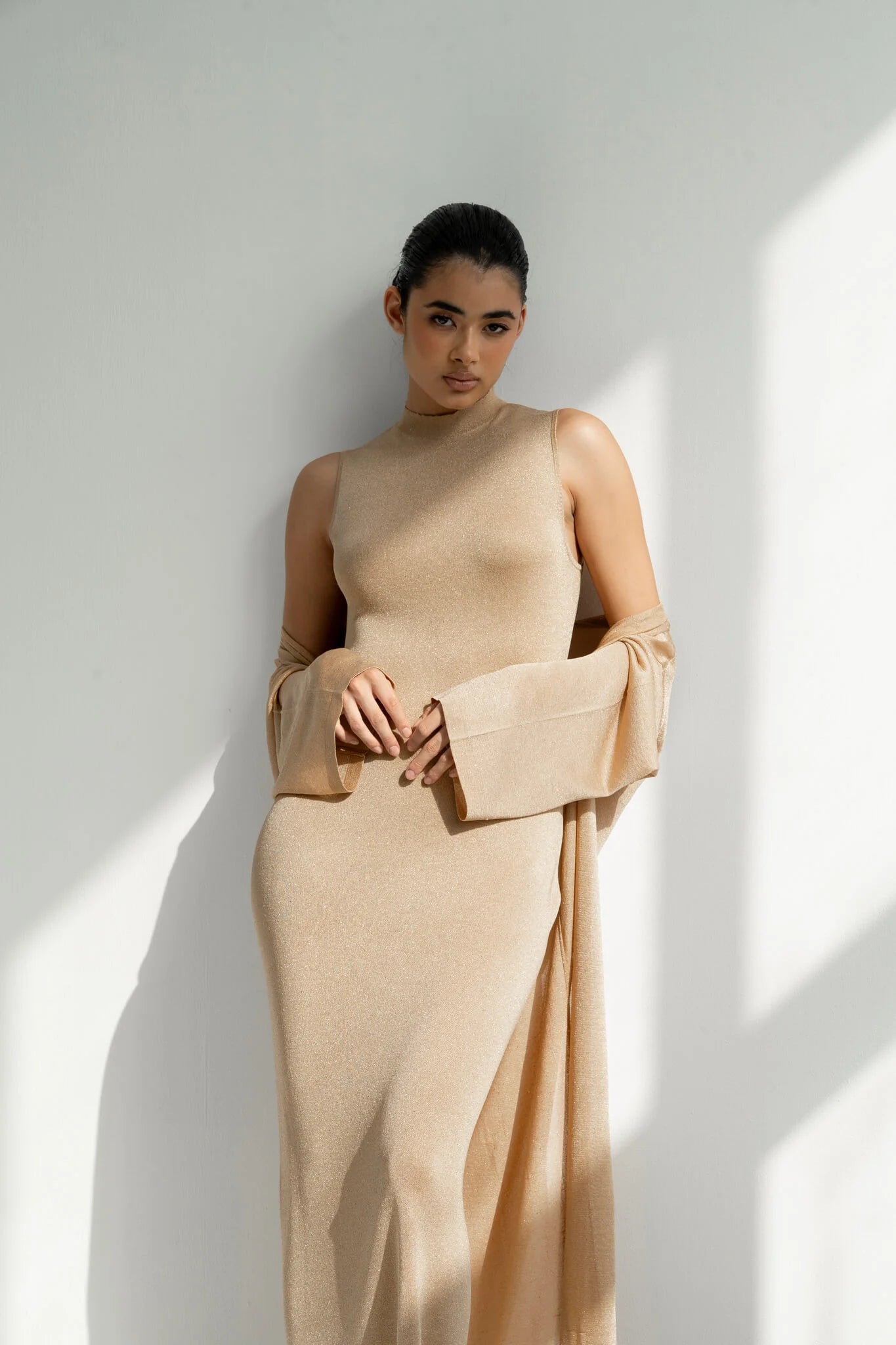 Elegant champagne gold sleeveless dress with matching long flowing sleeves and clutch bag — Nora The Label | Endless UAE