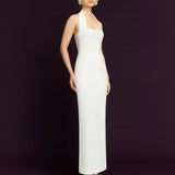 Elegant white halter neck maxi dress with fitted silhouette and floor-length hem on model — Solace London | Endless UAE