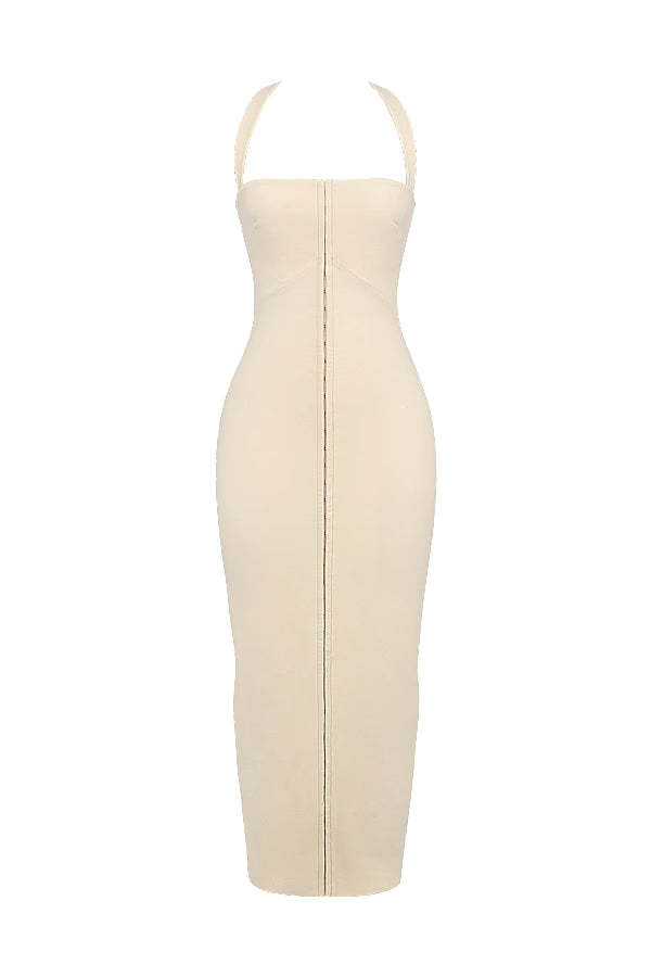 Woman wearing cream halter maxi dress with front zip detail and strappy white sandals — House of CB | Endless UAE