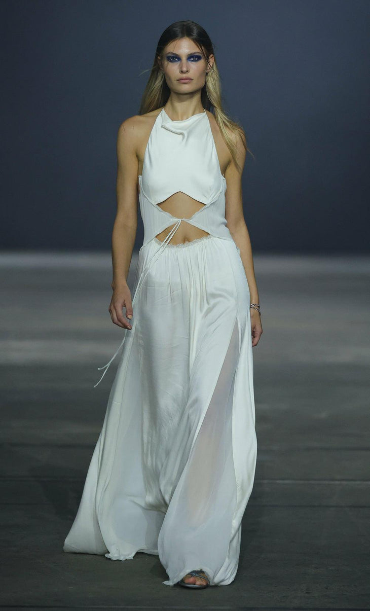 Elegant white halter maxi dress with cutout waist detail and flowing skirt on runway model — Bec & Bridge | Endless UAE