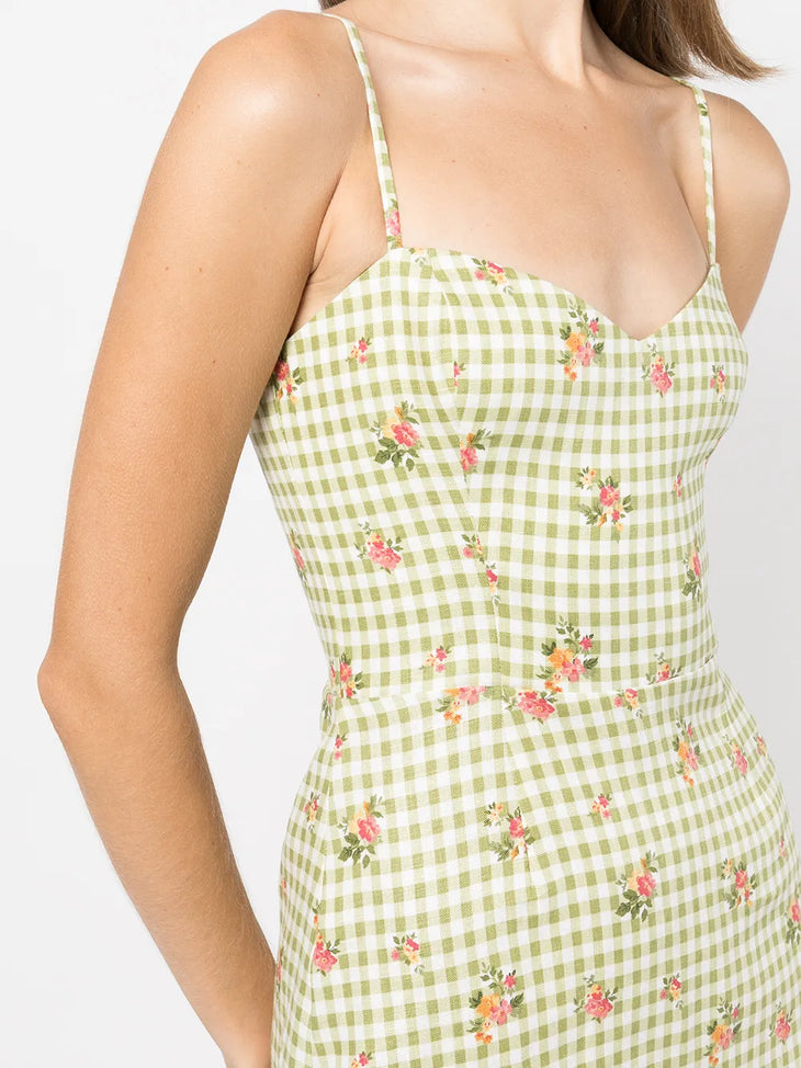 Green and white gingham dress with pink floral print, featuring thin straps and fitted bodice — Reformation | Endless UAE