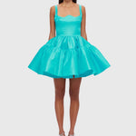 Woman wearing a turquoise structured mini dress with sweetheart neckline and full skirt — Leo Lin | Endless UAE