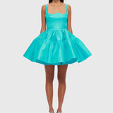Woman wearing a turquoise structured mini dress with sweetheart neckline and full skirt — Leo Lin | Endless UAE