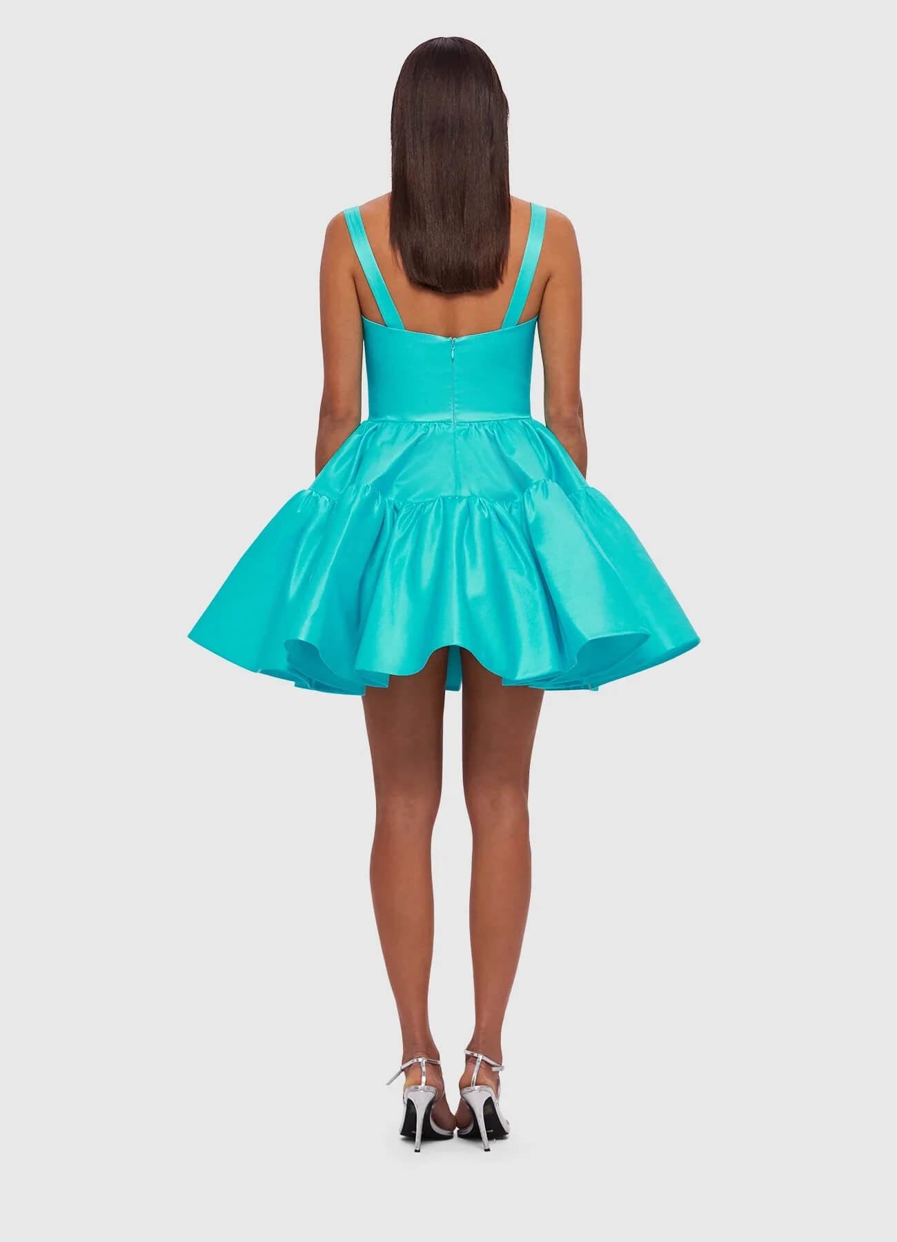 Woman wearing a turquoise structured mini dress with sweetheart neckline and full skirt — Leo Lin | Endless UAE