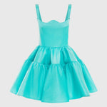 Woman wearing a turquoise structured mini dress with sweetheart neckline and full skirt — Leo Lin | Endless UAE