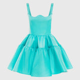 Woman wearing a turquoise structured mini dress with sweetheart neckline and full skirt — Leo Lin | Endless UAE