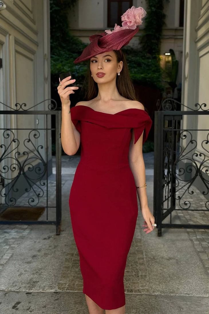 Woman wearing burgundy off-shoulder Tilly Pencil Dress with tied sleeves and black heels — The Pretty Dress Company | Endless UAE