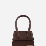 Brown leather mini tote bag with distinctive curved handles and gold Jacquemus logo — Jacquemus | Endless UAE