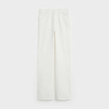 Folded white denim jeans with visible back pocket detail — Celine | Endless UAE