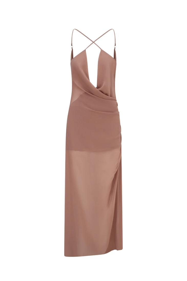 Woman wearing dusty rose Gaia Maxi Dress by a serene alpine lake with mountains — Scorpio Rizing | Endless UAE