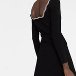 Black long-sleeved mini dress with scalloped crystal rhinestone trim along neckline and hem, shown from back view — Sandro | Endless UAE