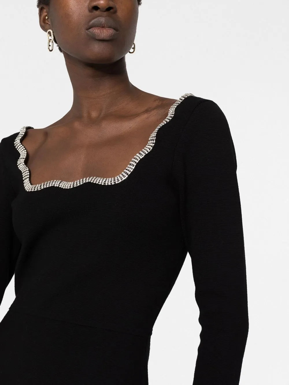 Black long-sleeve dress with crystal-embellished scalloped neckline trim, worn by model showing upper body detail — Sandro | Endless UAE