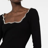 Black long-sleeve dress with crystal-embellished scalloped neckline trim, worn by model showing upper body detail — Sandro | Endless UAE