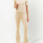 Cream ribbed knit flare pants with high waist and fitted silhouette — Courrēges | Endless UAE