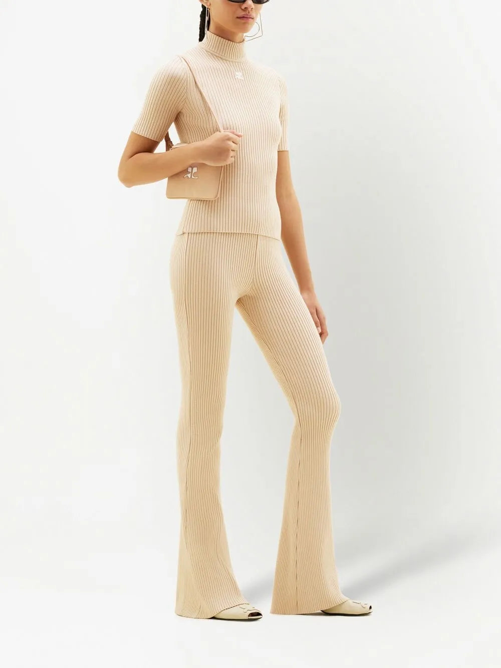 Cream ribbed knit flare pants with high waist and fitted silhouette — Courrēges | Endless UAE