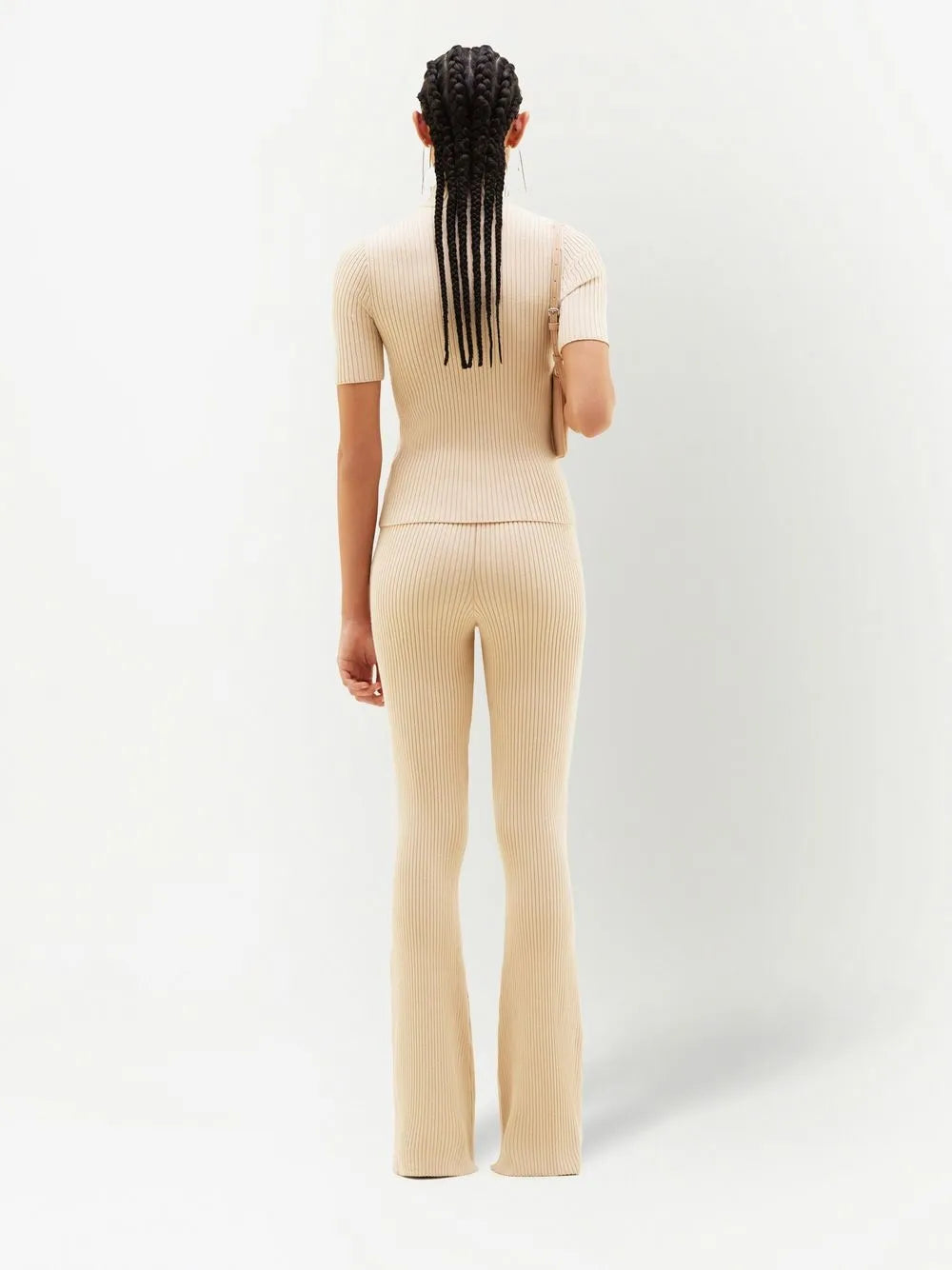 Cream ribbed knit flare pants with high waist and fitted silhouette — Courrēges | Endless UAE
