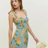 Floral print mini dress with tie shoulder straps and fitted bodice in blue with yellow blooms — Reformation | Endless UAE