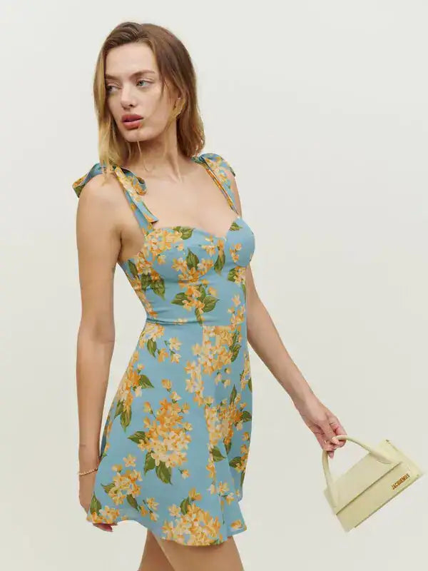 Floral print mini dress with tie shoulder straps and fitted bodice in blue with yellow blooms — Reformation | Endless UAE