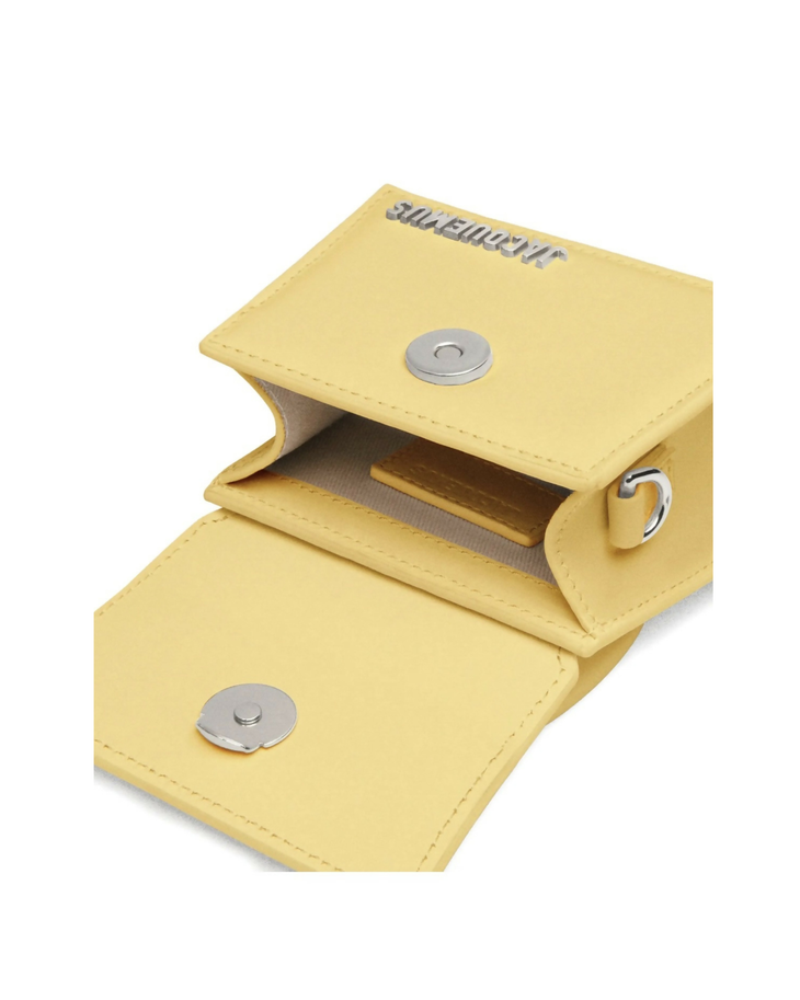 Pale yellow mini handbag with curved top handle and contrasting stitching detail — Jacquemus | Endless UAE