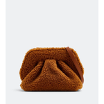 Gea Clutch in caramel brown textured fabric held in hand — TheMoire | Endless UAE