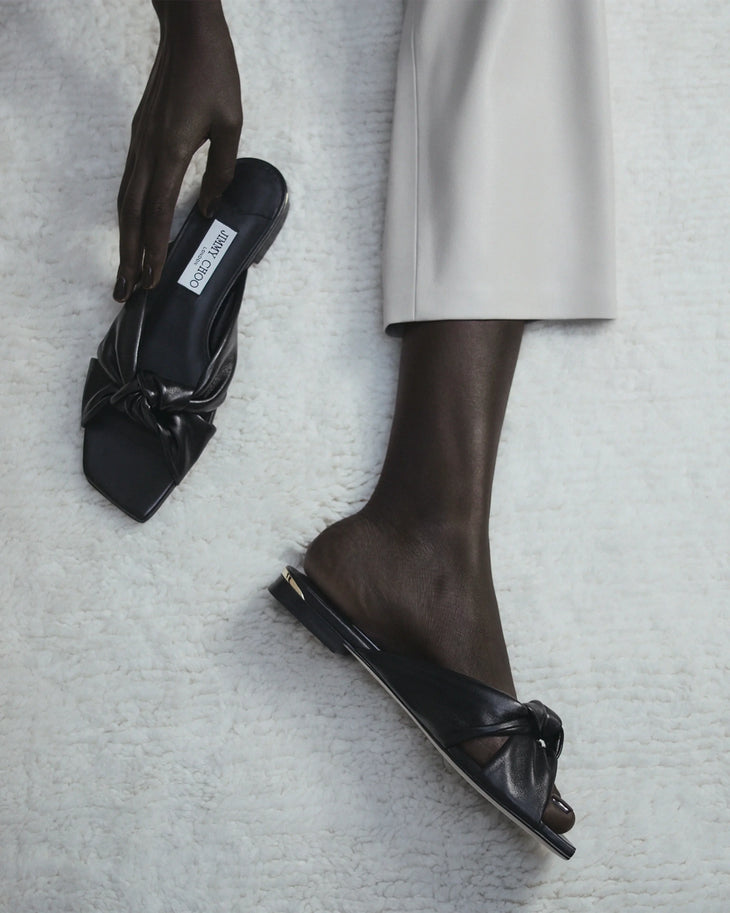 Black leather flat sandals with bow detail — Jimmy Choo | Endless UAE