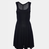 Black sleeveless midi dress with textured embroidered knit, mesh neckline detail, and flared skirt — Alaia | Endless UAE